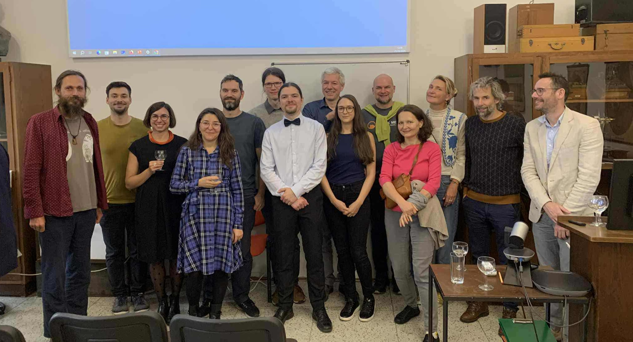 Vojtěch Schmidt (center) with the Petrášek Lab and PhD defense committee, October 2025